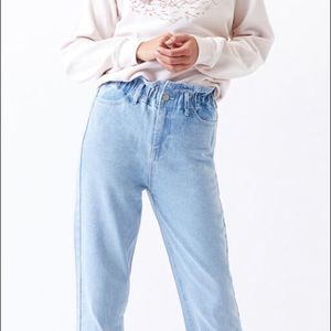 Blue high waisted mom jeans with scrunched top.
